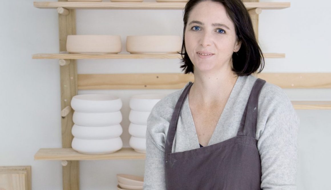 Throwing pottery on wheel.